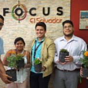 Focus agents at the Las Cascadas location holding plants.