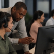 Contact center employees engaged in quality assurance training, monitoring service delivery and performance improvement.
